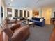Open-concept living room with hardwood floors, ceiling fans, and stylish decor at 21 George St # 102, Charleston, SC 29401