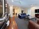 Bright living room with hardwood floors, and an open floor plan to the kitchen at 21 George St # 102, Charleston, SC 29401