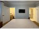 Comfortable main bedroom with open closet and bathroom entrances at 21 George St # 102, Charleston, SC 29401
