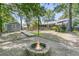 Spacious backyard featuring a fire pit, shed, wooden deck, and lush greenery at 211 White Church Ln, Summerville, SC 29485
