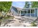 Backyard with a patio, swing, and a screened-in porch, creating an inviting space for leisure and entertainment at 211 White Church Ln, Summerville, SC 29485