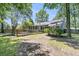 Large backyard with a screened in porch and wooden deck overlooking the well-manicured lawn at 211 White Church Ln, Summerville, SC 29485
