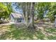 Lush backyard with a wooden deck, patio, swing set, and beautiful landscaping, creating an ideal outdoor retreat at 211 White Church Ln, Summerville, SC 29485