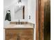 Bathroom vanity featuring granite counters, wooden cabinets, and a towel rack in close proximity to the sink at 211 White Church Ln, Summerville, SC 29485