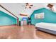 Bright bedroom with wood floors, ceiling fan and arcade game at 211 White Church Ln, Summerville, SC 29485