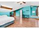 Bright bedroom with wood floors, ceiling fan, desk and storage shelves at 211 White Church Ln, Summerville, SC 29485