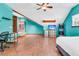 Bright bedroom with wood floors, ceiling fan, desk and arcade game at 211 White Church Ln, Summerville, SC 29485