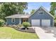 Charming home with a two-car garage, landscaped front yard and beautiful lawn at 211 White Church Ln, Summerville, SC 29485