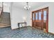 Entrance with slate floors, chandelier and hardwood stairs in a light and bright space at 211 White Church Ln, Summerville, SC 29485