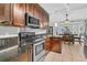 Cozy kitchen featuring stainless steel appliances, speckled granite countertops, and wood cabinets at 211 White Church Ln, Summerville, SC 29485