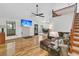 Bright living room with hardwood floors, tall ceilings, and a loft area above at 211 White Church Ln, Summerville, SC 29485