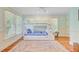 Bright bedroom featuring a white bunk bed with a pull out trundle and large sunny windows at 22 Beachwood East, Isle of Palms, SC 29451