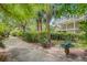 Well maintained landscape with a walkway leads to the beautiful home with double porches at 22 Beachwood East, Isle of Palms, SC 29451