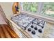 Stainless steel stovetop inset into granite countertop and cabinets at 22 Beachwood East, Isle of Palms, SC 29451