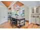 Island kitchen has wood floors, wooden ceiling, beams, and updated cabinets and appliances at 22 Beachwood East, Isle of Palms, SC 29451