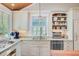 Kitchen with granite countertops, cabinets, sink and stainless steel appliances at 22 Beachwood East, Isle of Palms, SC 29451