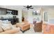 Living area with dark mini bar, hardwood floors and beach themed decor at 22 Beachwood East, Isle of Palms, SC 29451