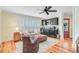 Cozy living area featuring mini bar, hardwood floors and beach-themed rug at 22 Beachwood East, Isle of Palms, SC 29451