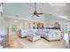 Spacious living room with high ceilings, a large sectional sofa, and open access to other areas of the house at 22 Beachwood East, Isle of Palms, SC 29451