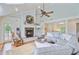 Inviting living room with fireplace, comfortable seating, and access to an outdoor porch at 22 Beachwood East, Isle of Palms, SC 29451