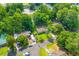 Aerial view of a house with a green lawn surrounded by mature trees in a residential neighborhood at 230 Azalea Ct, Moncks Corner, SC 29461