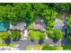Aerial view of a home showing the green lawn, trees, street and driveway in a neighborhood at 230 Azalea Ct, Moncks Corner, SC 29461