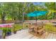 Inviting backyard deck, perfect for outdoor dining and relaxation under a patio umbrella at 230 Azalea Ct, Moncks Corner, SC 29461