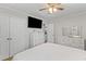 Spacious bedroom with natural light, wood floors, ceiling fan, and ample storage at 230 Azalea Ct, Moncks Corner, SC 29461