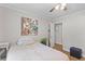 Comfortable bedroom with closet, ceiling fan, wood floors, and soft, natural light at 230 Azalea Ct, Moncks Corner, SC 29461