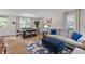 Bright and airy living room featuring a cozy sofa, stylish rug, and dining table at 230 Azalea Ct, Moncks Corner, SC 29461