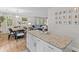 Bright, open-concept living and dining area with wood flooring and fresh, neutral paint at 230 Azalea Ct, Moncks Corner, SC 29461
