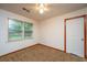 Bedroom with carpet, natural light from window, and ceiling fan at 2567 Mona Ave, Charleston, SC 29414