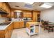 Bright kitchen with wood cabinets, white countertops, and stainless steel appliances at 2567 Mona Ave, Charleston, SC 29414