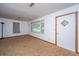 Bright living room features carpet, a large window, and neutral walls at 2567 Mona Ave, Charleston, SC 29414