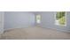 Neutral bedroom with large windows providing natural light at 261 Sweet Alyssum Dr, Ladson, SC 29456