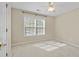 Bedroom featuring neutral paint, ceiling fan, and large window at 261 Sweet Alyssum Dr, Ladson, SC 29456