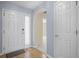 Welcoming entryway boasts hardwood floors, a stylish front door, and a glimpse into the home's interior at 261 Sweet Alyssum Dr, Ladson, SC 29456