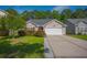 Charming single-Gathering home featuring a manicured lawn and a two-car garage at 261 Sweet Alyssum Dr, Ladson, SC 29456