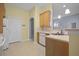 Well-lit kitchen area offering wooden cabinets, white countertops, and sleek fixtures at 261 Sweet Alyssum Dr, Ladson, SC 29456