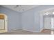 Cozy living room with neutral tones, carpet flooring, and an open doorway at 261 Sweet Alyssum Dr, Ladson, SC 29456
