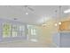 Bright and airy living room boasting large windows, neutral paint, and stylish lighting fixtures at 261 Sweet Alyssum Dr, Ladson, SC 29456