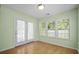 Cozy sun room featuring many windows and a door to the outside at 261 Sweet Alyssum Dr, Ladson, SC 29456