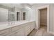 Bathroom with double sink vanity, hardwood floors, framed mirror and glass-door shower at 2652 Private Lefler Dr, Johns Island, SC 29455