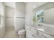 Well-lit bathroom featuring a white vanity with sink, toilet, and bathtub/shower combo at 2652 Private Lefler Dr, Johns Island, SC 29455
