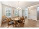 Light-filled dining room featuring a wooden table, six chairs, and hardwood floors at 2652 Private Lefler Dr, Johns Island, SC 29455