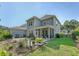 Charming home featuring a screened porch, landscaped yard and stone patio enhance outdoor living at 2652 Private Lefler Dr, Johns Island, SC 29455