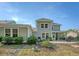 A beautiful home exterior, with a screened porch and stone patio create an inviting outdoor space at 2652 Private Lefler Dr, Johns Island, SC 29455
