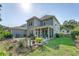 A screened porch, landscaped yard and stone patio enhance the home's outdoor living space at 2652 Private Lefler Dr, Johns Island, SC 29455