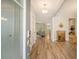 Bright foyer with hardwood floors, open layout to living spaces, and modern entryway features at 2652 Private Lefler Dr, Johns Island, SC 29455