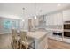 Well-equipped kitchen with island seating, stainless steel appliances, and sleek white cabinetry at 2652 Private Lefler Dr, Johns Island, SC 29455